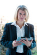 Business woman holding a touchscreen table