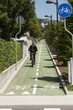 Businessman in suit riding bicycle to work
