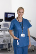Ultrasound technician standing with equipment