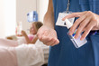 Nurse applying hand sanitizer in hospital
