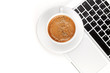 Cappuccino cup on laptop. Above view Cappuccino cup on laptop. Above view