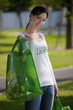 Casual woman with reusable shopping bags
