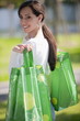 Casual woman with reusable shopping bags