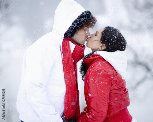 Photo: Young couple kissing on winter day Young couple kissing on winter day