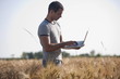 Photo: Man with laptop computer in wheat field Man with laptop computer in wheat field