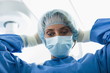 Surgeon wearing surgical mask in operating room