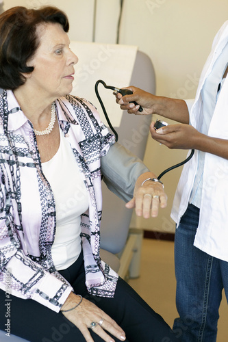 Photo: A senior woman having her blood pressure checked A senior woman having her blood pressure checked
