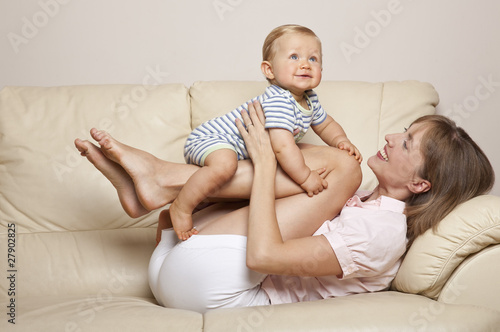 Photo: Child and mother playing on the sofa Child and mother playing on the sofa
