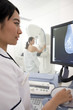 Radiologist reviewing results of patients mammogram