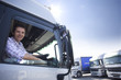 Truck driver driving semi-truck