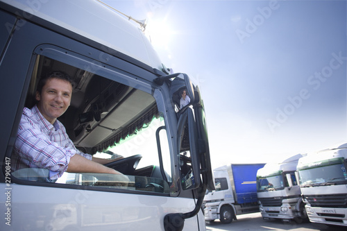 Photo: Truck driver driving semi-truck Truck driver driving semi-truck