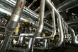 Equipment, cables and piping as found inside of a modern industr