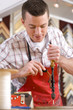 Craftsman working on frame in frame shop