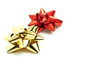 gold and red bows isolated on white