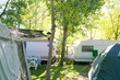Camping tents caravan in green trees outdoor Camping tents caravan in green trees outdoor