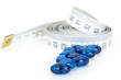 White neasure tape with blue diet pills
