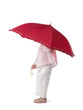 Little girl hiding under an an umbrella