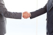 close up of businessmen shaking their hands after a meeting