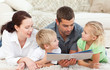 Cute family reading a children's book