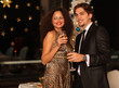 Happy young couple with champagne glasses