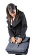 woman is closing the suitcase