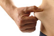 Foto: Mann mit Bauch kneift sich in die Seite Mann mit Bauch kneift sich in die Seite