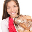Woman showing fresh baked bread