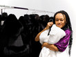 Woman tries on a white mink fur coat