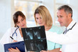 Medical team looking at X-ray