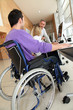 Photo: Man in wheelchair working in the office Man in wheelchair working in the office