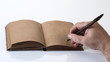 Male writing on a recycled paper notes