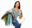 Enthusiastic brunette holding shopping bags