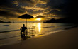 Person relaxing and watching sunset