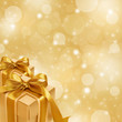 gold gift box on abstract gold Christmas background gold gift box on abstract gold Christmas background