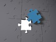 A blue puzzle piece on grey pieces