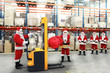 santa clauses in the line for the sacks of gifts in storehouse santa clauses in the line for the sacks of gifts in storehouse