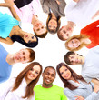 Low angle view of happy men and women standing