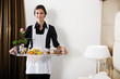 Happy Maid Carrying Breakfast Tray