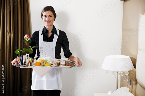 Photo: Happy Maid Carrying Breakfast Tray Happy Maid Carrying Breakfast Tray