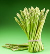 Sheaf of asparagus on a green background. Sheaf of asparagus on a green background.