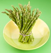 Sheaf of asparagus on a green background. Sheaf of asparagus on a green background.