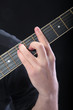 Human hand taking A-major accord at guitar Human hand taking A-major accord at guitar