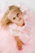 little girl in a pink elegant dress.