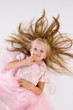 little girl in a pink elegant dress.