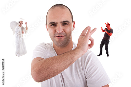 Photo: young man with a finger removing the devil young man with a finger removing the devil
