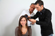 Hairdresser and trainee putting hair-curlers
