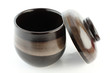 Japanese ceramic cup for tea or soup. On white paper.