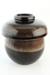 Japanese ceramic cup for tea or soup. On white paper.