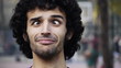 Young man funny face squinting skew eyed eye Young man funny face squinting skew eyed eye