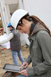Woman engineer helmet standing on construction site